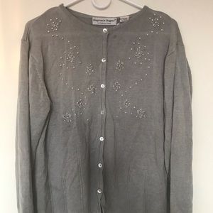 Grey woman’s cardigan used with small pearls on front